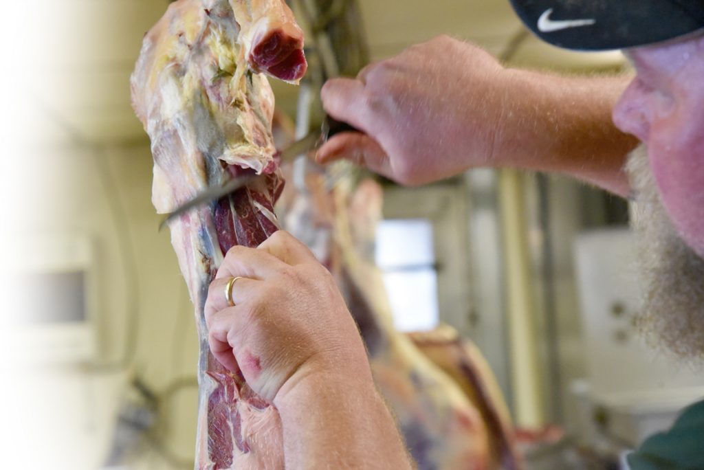 Butcher making initial cuts at Sudlersville Meat Locker