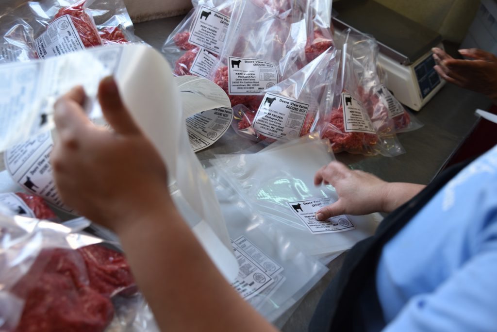 Ground beef being packaged and labeled